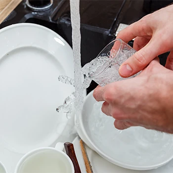 All dishes getting washed on the sink