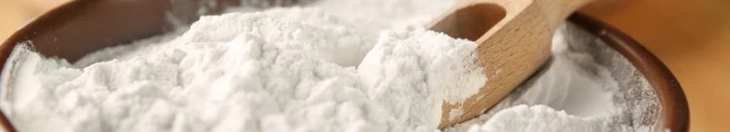 A cornstarch in a bowl with spoon